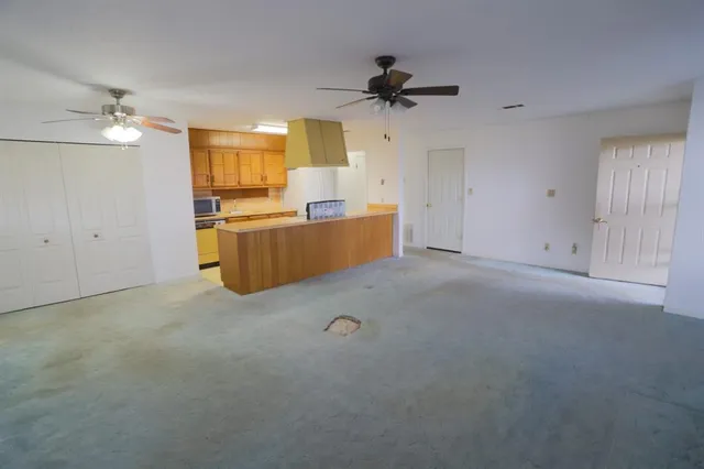a view of kitchen and windows