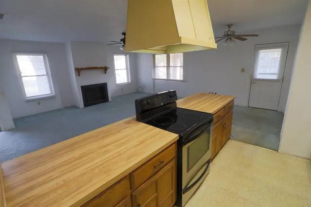 a kitchen that has a sink and a stove