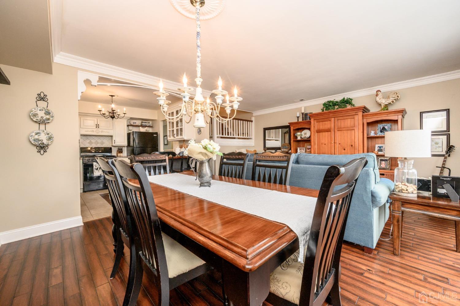 607 Randall Way Aberdeen, NJ 07747 - Photo 12 of 35 a view of a dining room with furniture and wooden floor