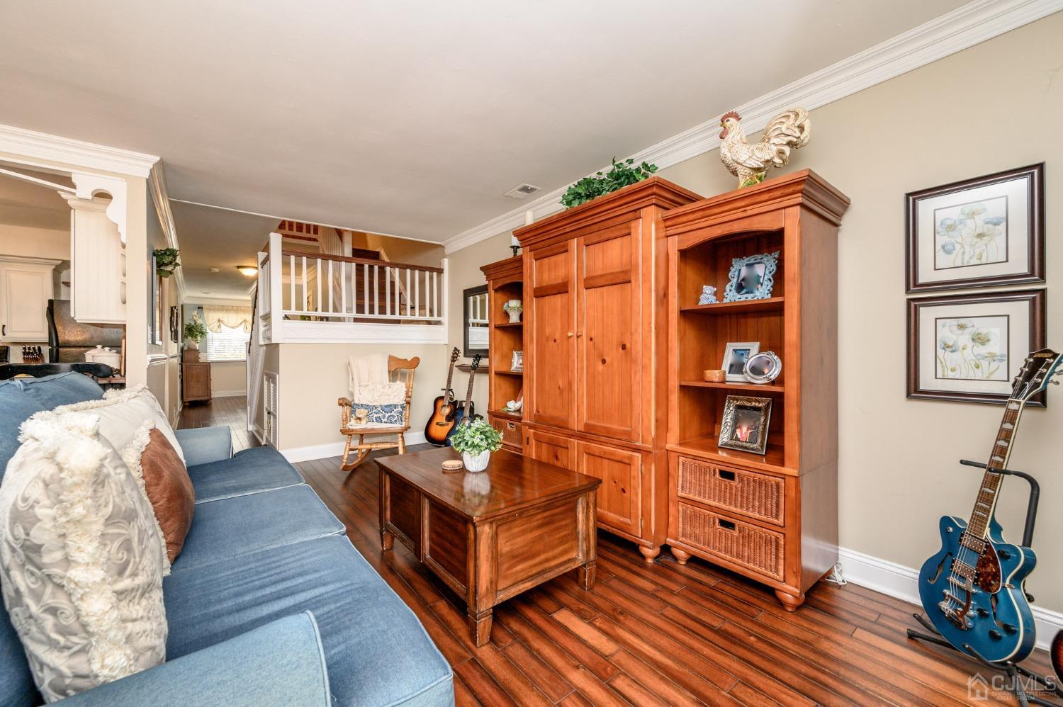 607 Randall Way Aberdeen, NJ 07747 - Photo 14 of 35 a bed room with furniture and a book shelf