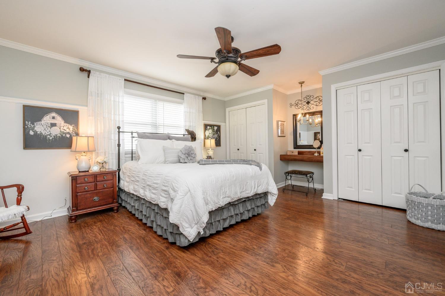 607 Randall Way Aberdeen, NJ 07747 - Photo 17 of 35 a bedroom with a bed and wooden floor