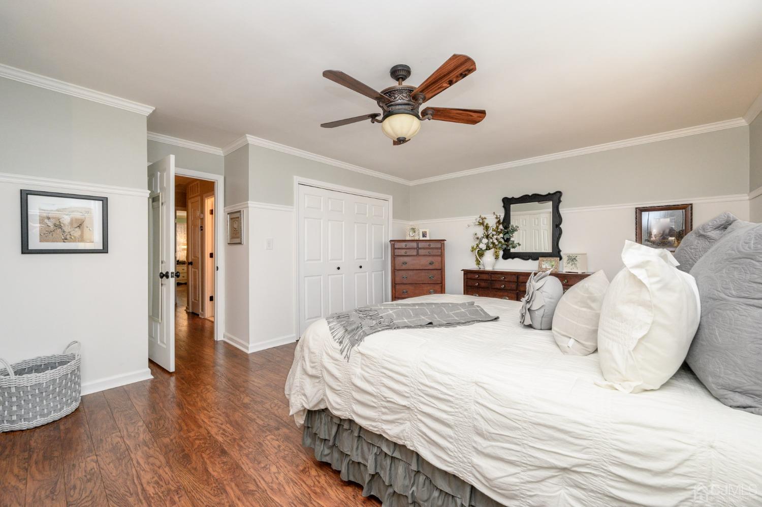 607 Randall Way Aberdeen, NJ 07747 - Photo 19 of 35 a bedroom with a bed and wooden floor