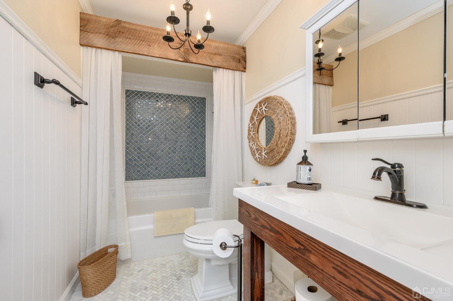 607 Randall Way Aberdeen, NJ 07747 - Photo 20 of 35 a bathroom with a sink a toilet and shower