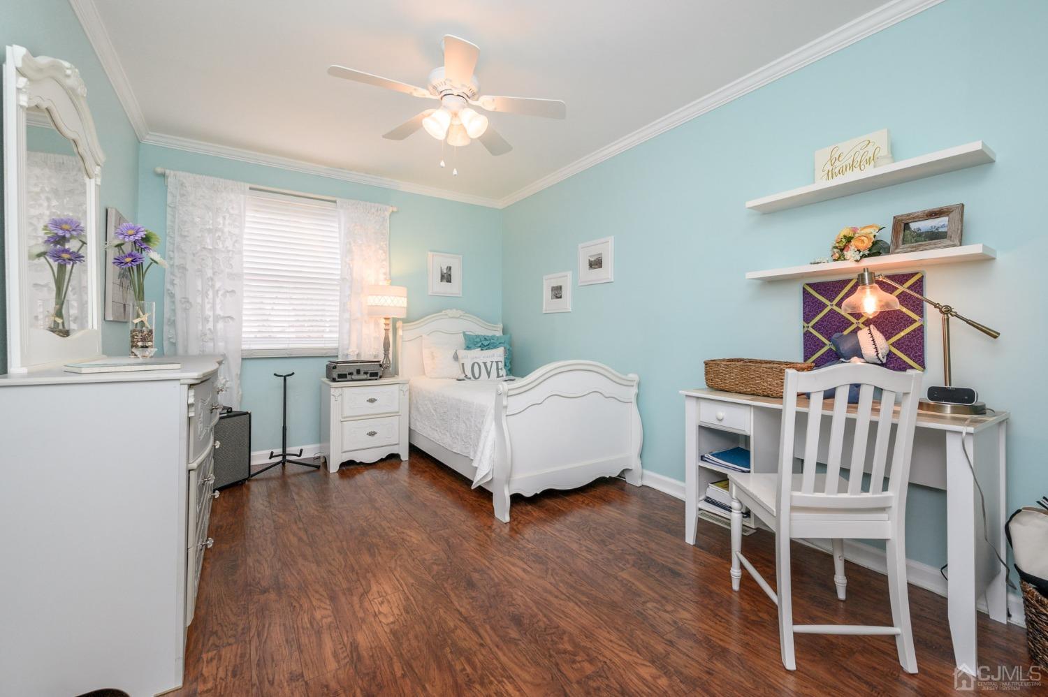 607 Randall Way Aberdeen, NJ 07747 - Photo 21 of 35 a living room with furniture and a wooden floor