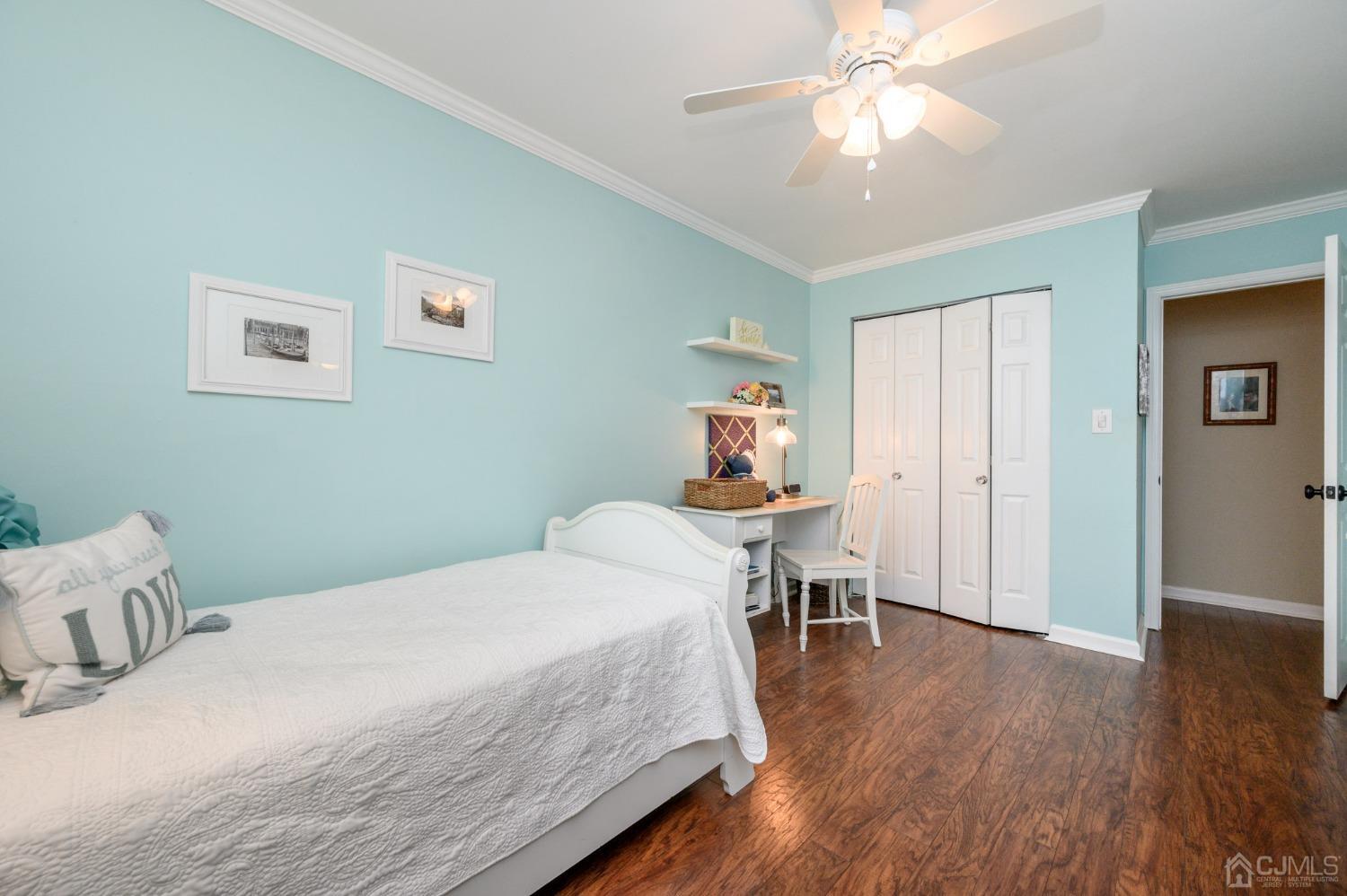 607 Randall Way Aberdeen, NJ 07747 - Photo 22 of 35 a bedroom with a bed and a table in it