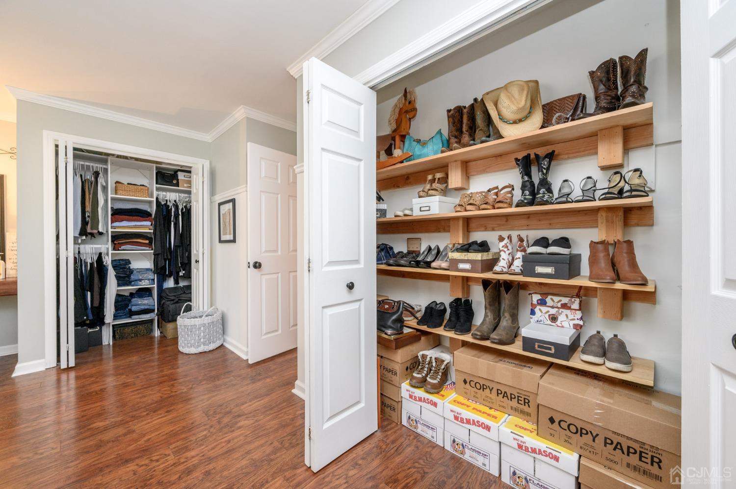 607 Randall Way Aberdeen, NJ 07747 - Photo 23 of 35 a room with a wooden floor and shoes