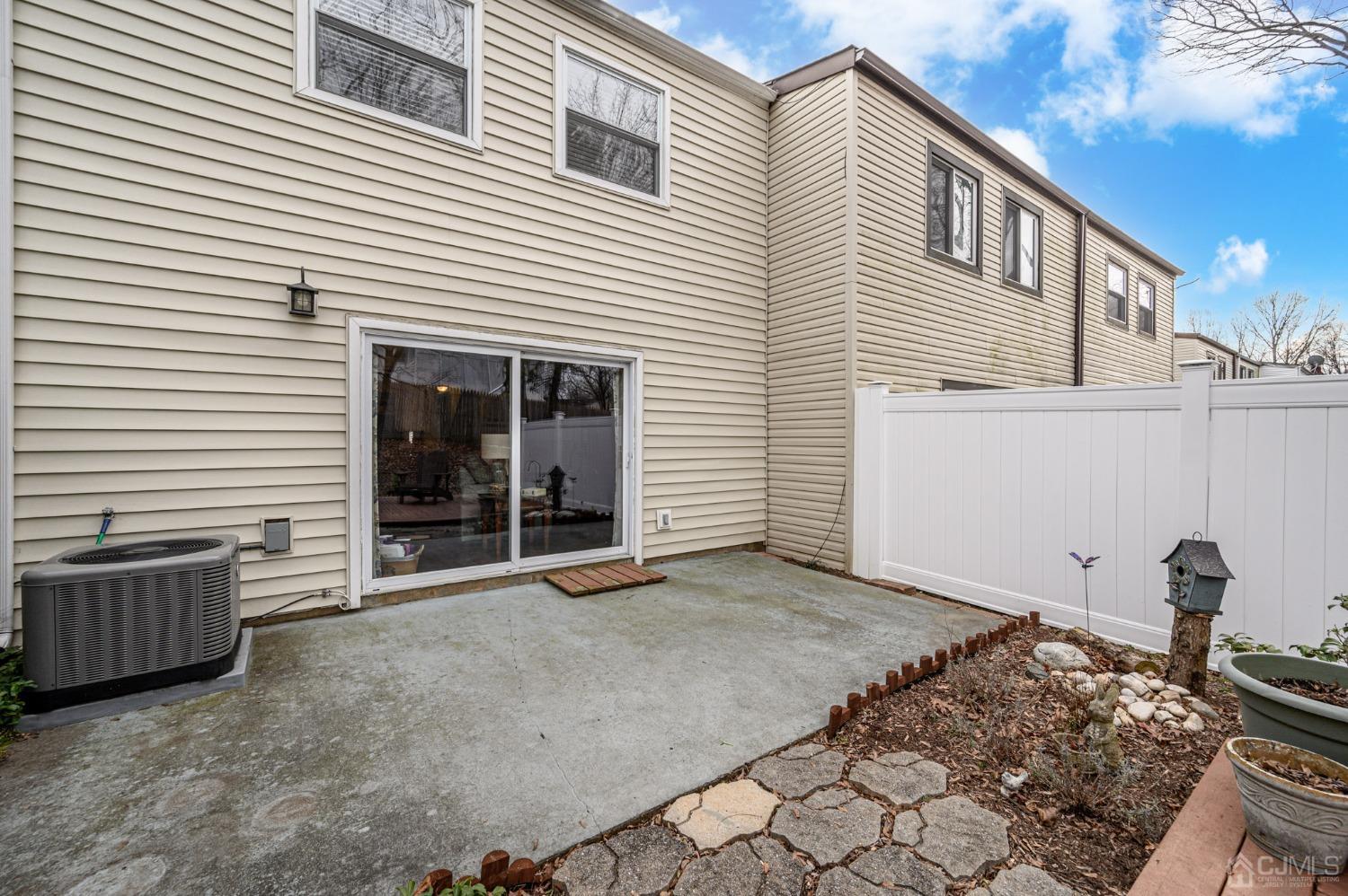 607 Randall Way Aberdeen, NJ 07747 - Photo 27 of 35 a view of a house with a large window and wooden fence