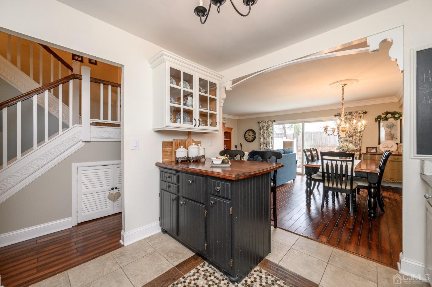 607 Randall Way Aberdeen, NJ 07747 - Photo 9 of 35 a kitchen with stainless steel appliances granite countertop a stove and a dining table