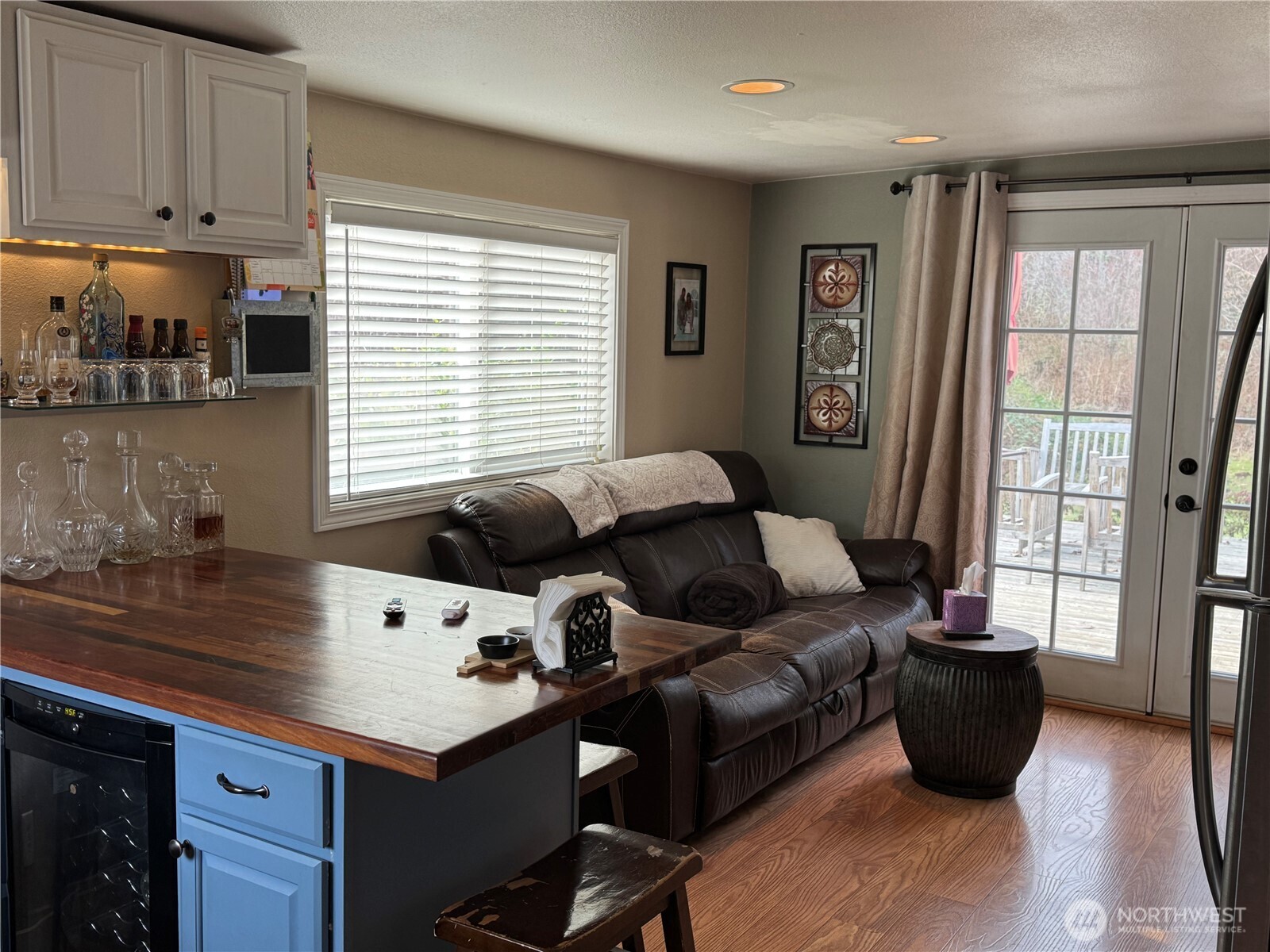 12514 Chain Lake Road Snohomish, WA 98290 - Photo 14 of 27 a living room with furniture and large windows