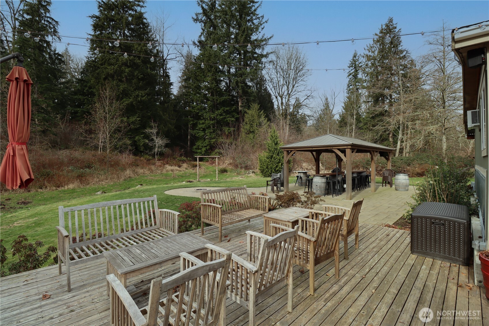 12514 Chain Lake Road Snohomish, WA 98290 - Photo 15 of 25 a view of a deck with furniture and a yard