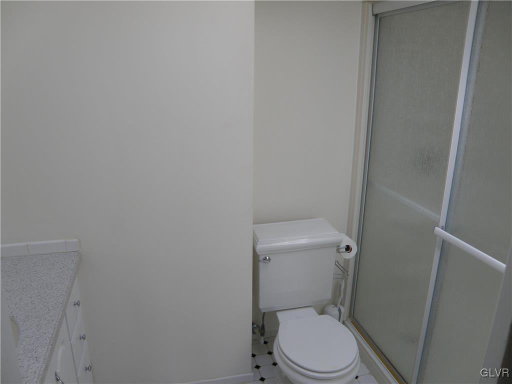 4202 Bethman Road Easton, PA 18045 - Photo 24 of 28 a white toilet sitting next to a white cabinet