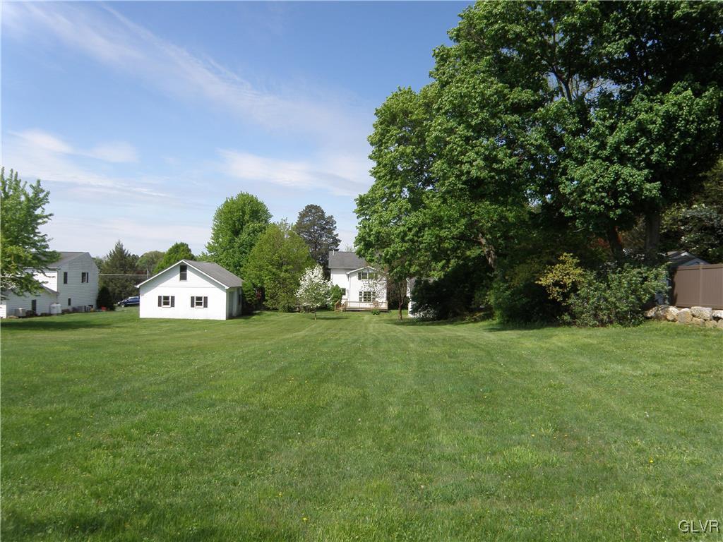 4202 Bethman Road Easton, PA 18045 - Photo 3 of 28 a front view of a house with a yard and trees