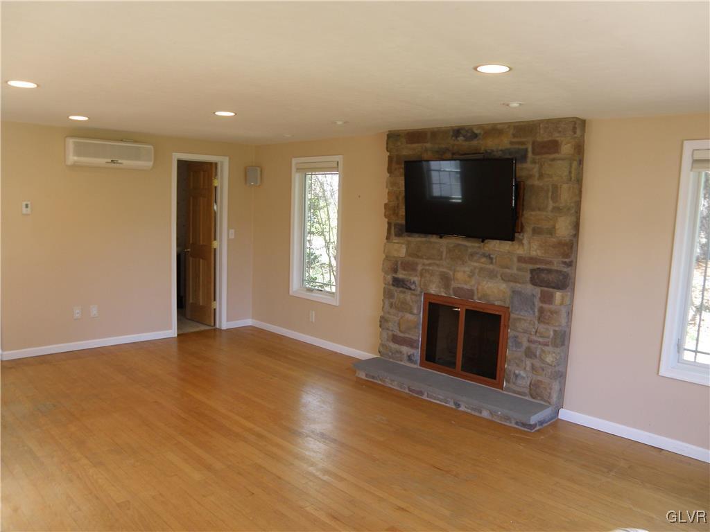 4202 Bethman Road Easton, PA 18045 - Photo 8 of 28 a view of an empty room with a fireplace and a window