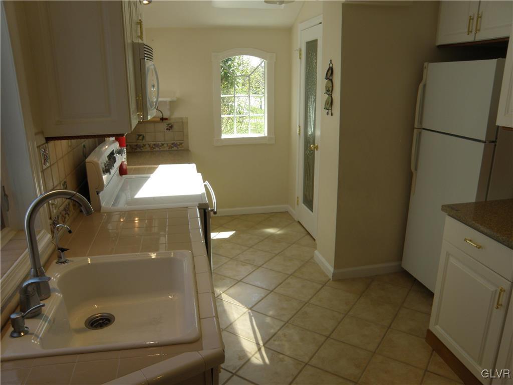 4202 Bethman Road Easton, PA 18045 - Photo 9 of 28 a bathroom with a sink and mirror