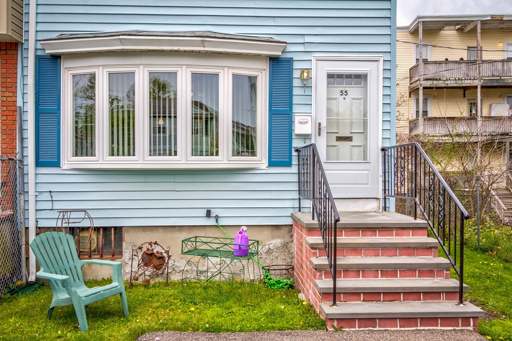 55 Jacob Street Boston, MA 02124 - Photo 1 of 22 a front view of a house with entryway and stairs