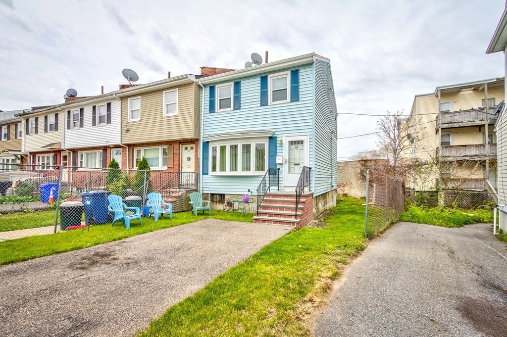 55 Jacob Street Boston, MA 02124 - Photo 22 of 22 a front view of a house with a yard table and chairs