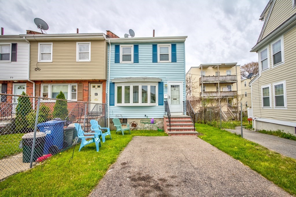 55 Jacob Street Boston, MA 02124 - Photo 3 of 22 a front view of a house with garden and yard