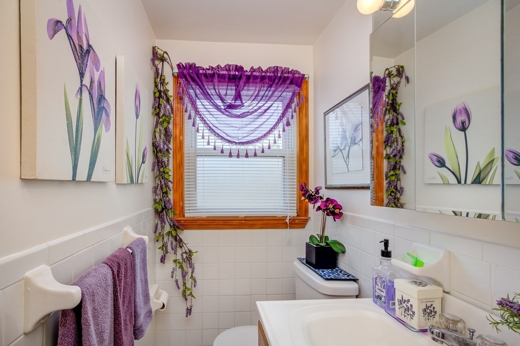55 Jacob Street Boston, MA 02124 - Photo 7 of 22 a bathroom with a sink and a mirror