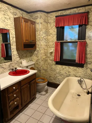 a bathroom with a sink and mirror