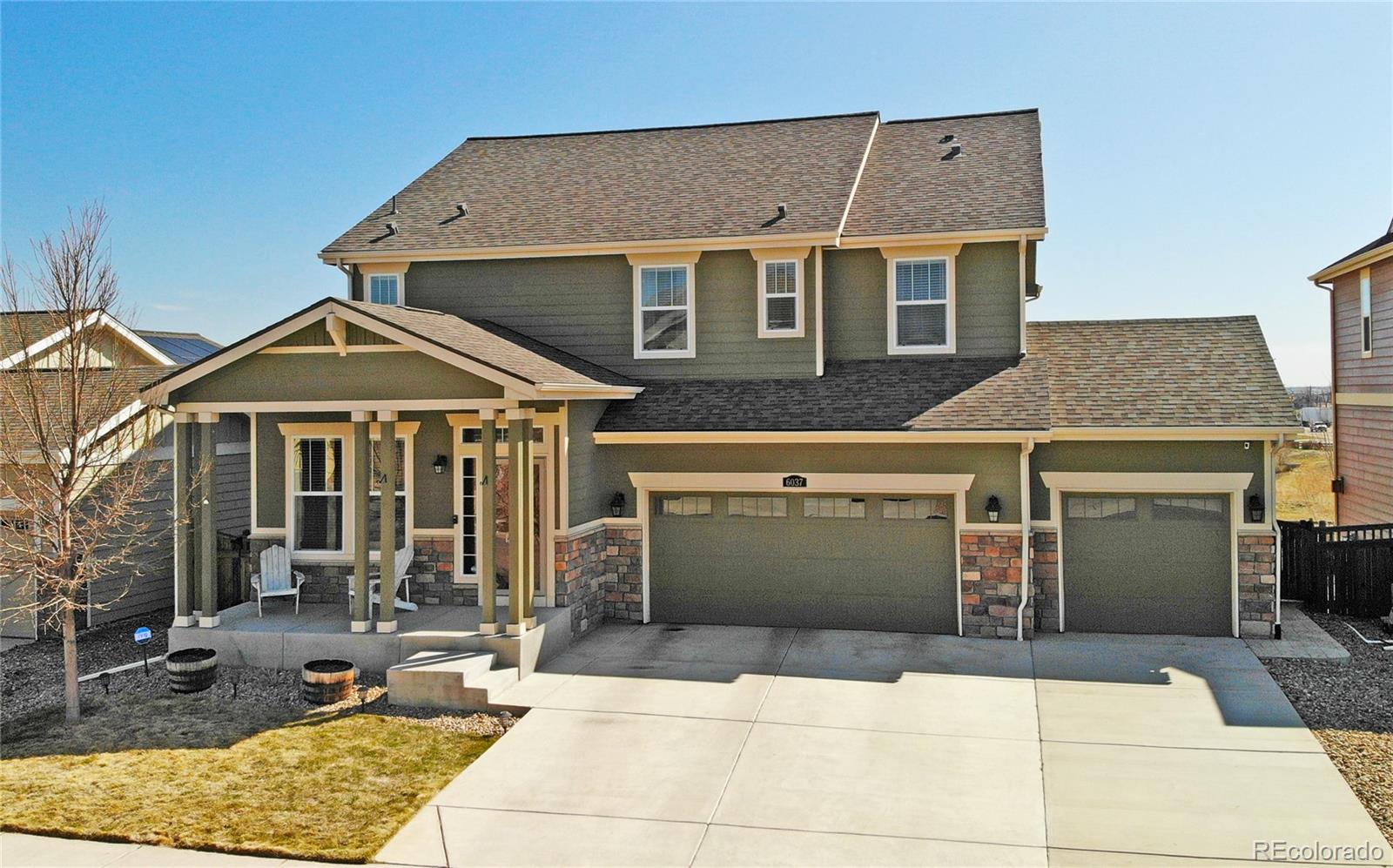 a front view of a house with a garage