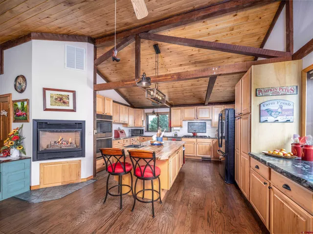 a open kitchen with a table and chairs