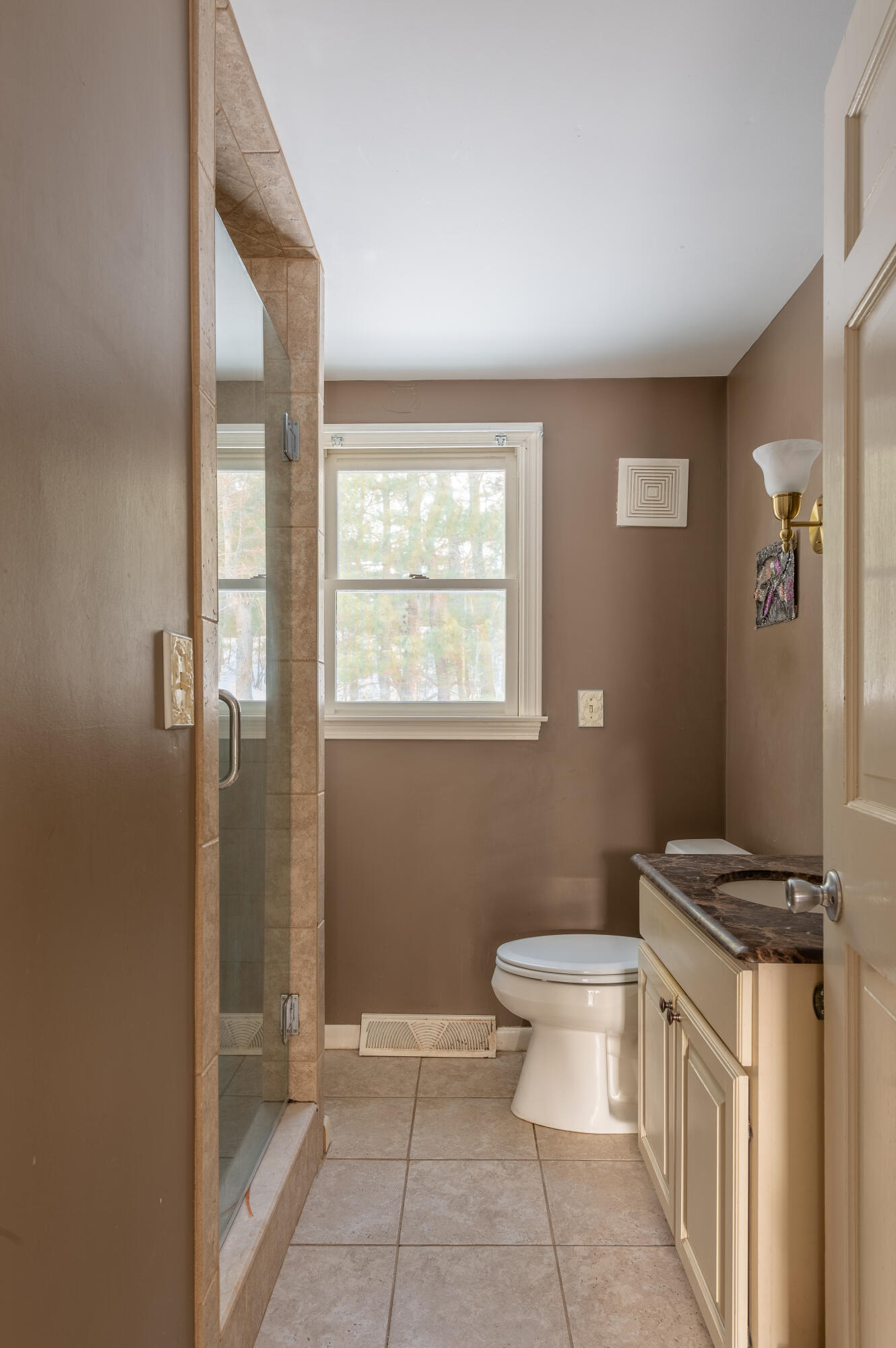 16 Michael Road Pocasset, MA 02559 - Photo 21 of 43 a bathroom with a granite countertop toilet a sink a mirror a window and vanity