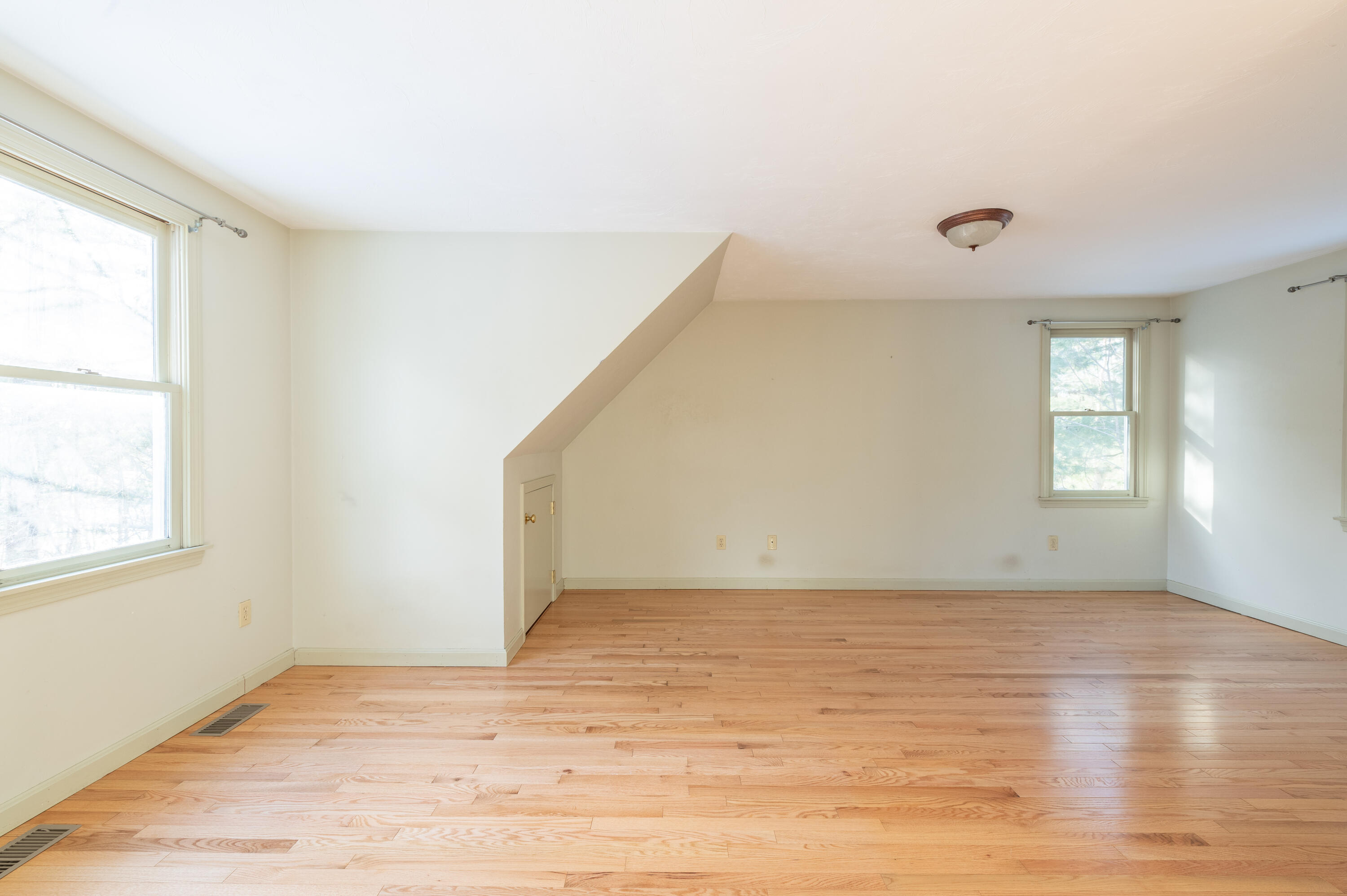 16 Michael Road Pocasset, MA 02559 - Photo 25 of 43 an empty room with wooden floor and windows