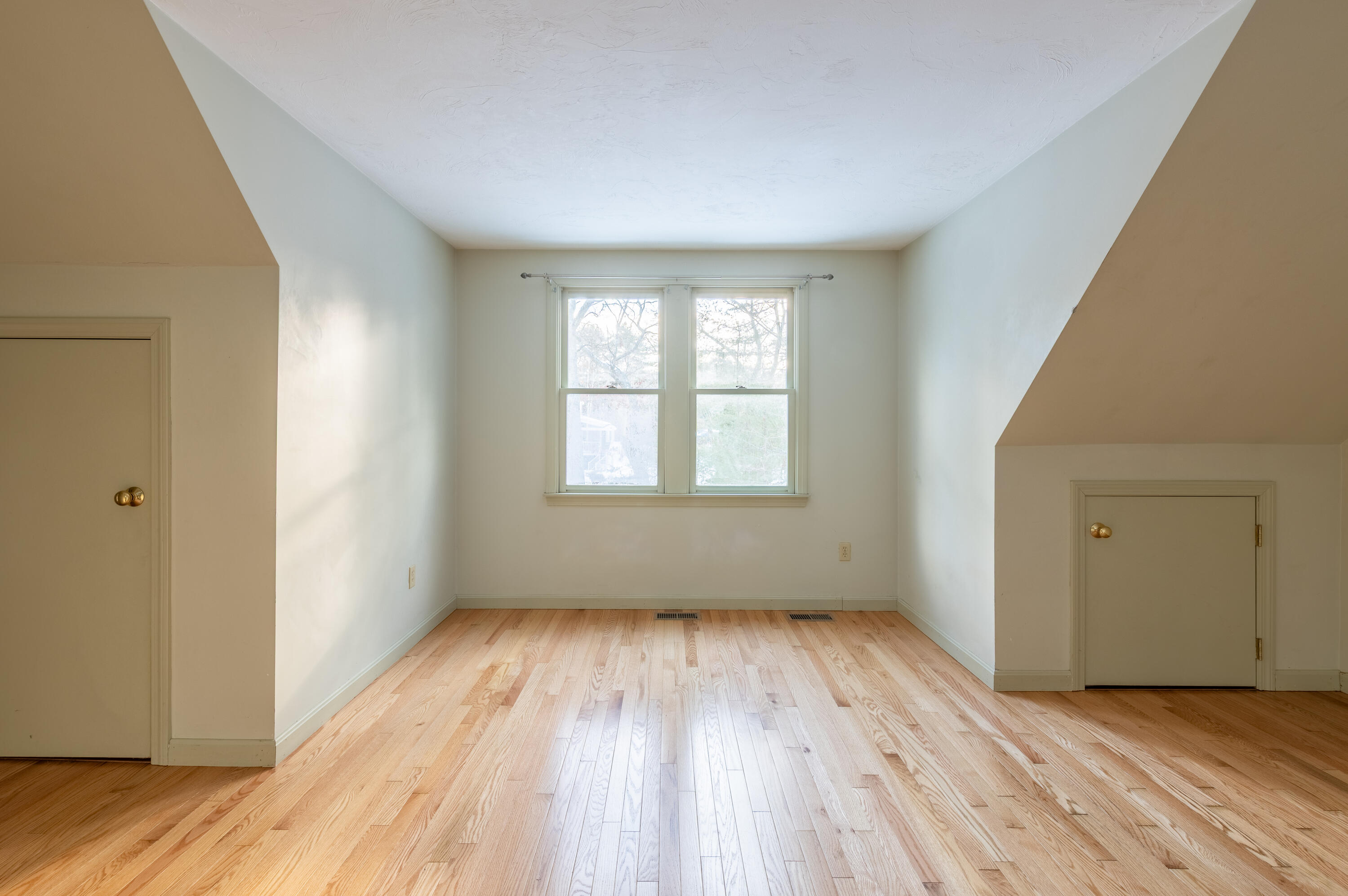 16 Michael Road Pocasset, MA 02559 - Photo 26 of 43 a view of an empty room with wooden floor and a window