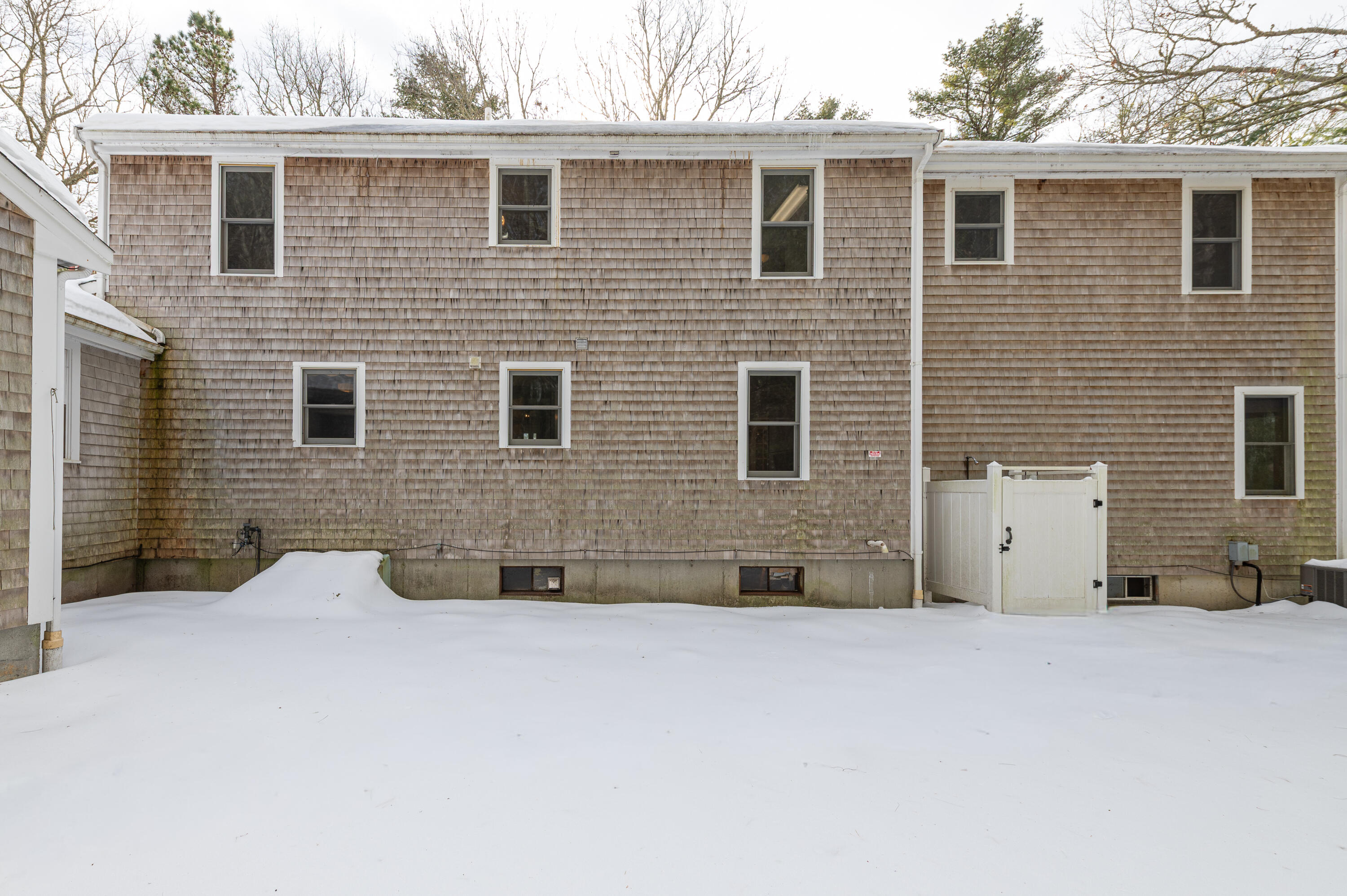 16 Michael Road Pocasset, MA 02559 - Photo 5 of 43 a view of a brick house with many windows