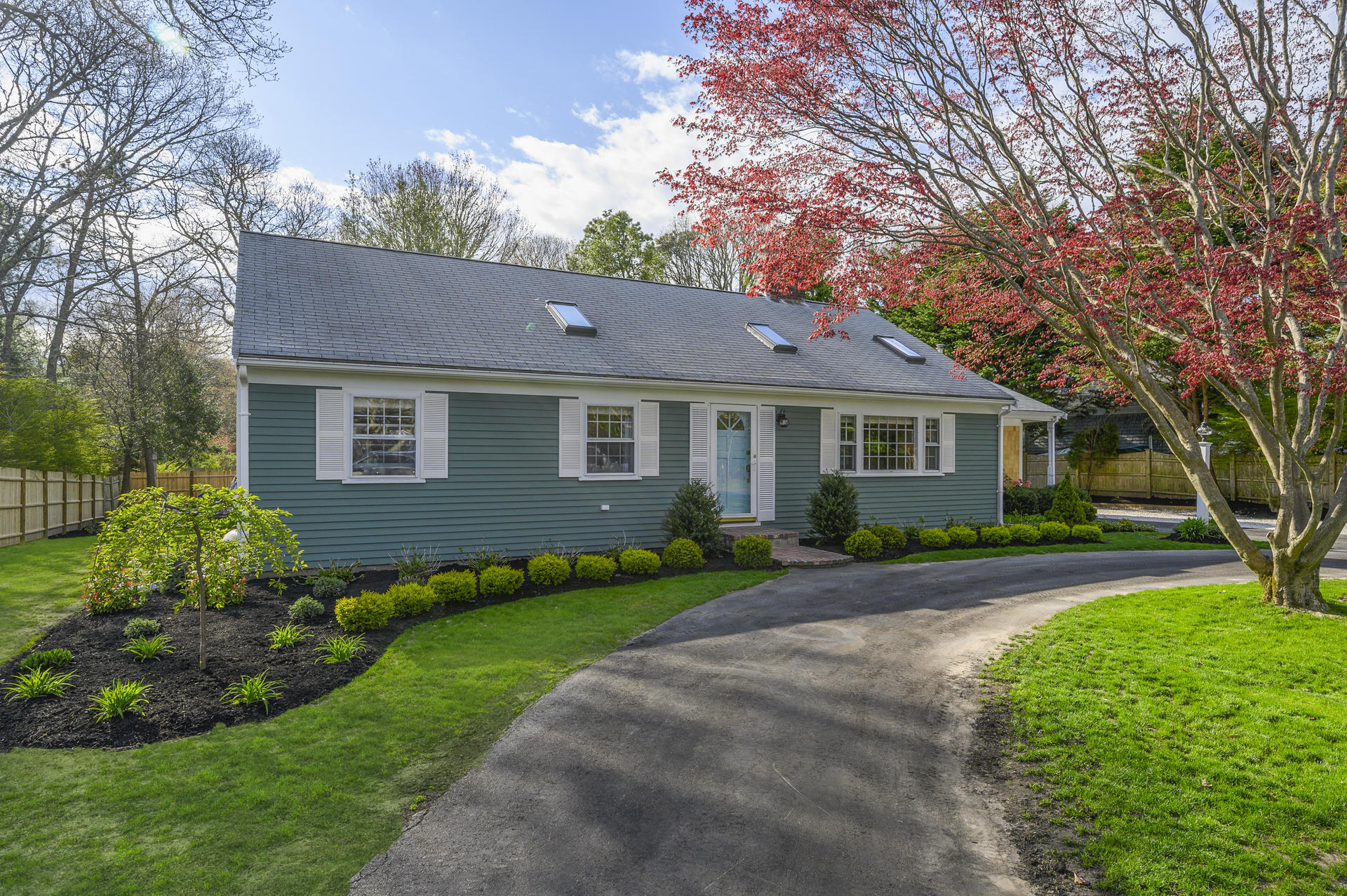 73 Knotty Pine Lane Centerville, MA 02632 - Photo 2 of 34 a front view of a house with a garden