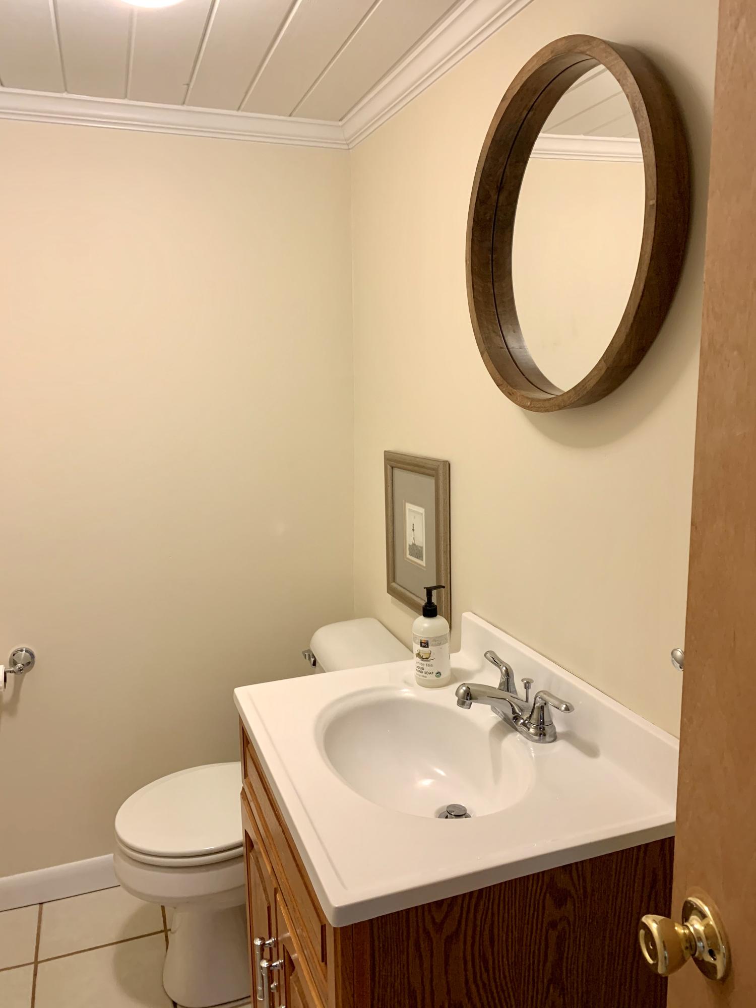 73 Knotty Pine Lane Centerville, MA 02632 - Photo 23 of 34 a bathroom with a sink and a mirror