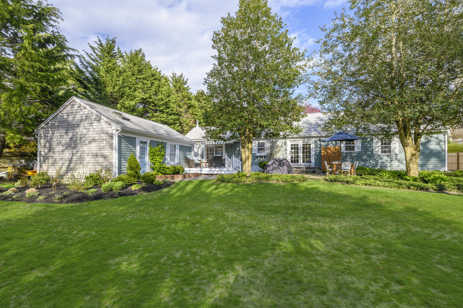 73 Knotty Pine Lane Centerville, MA 02632 - Photo 25 of 34 a front view of house with yard and green space