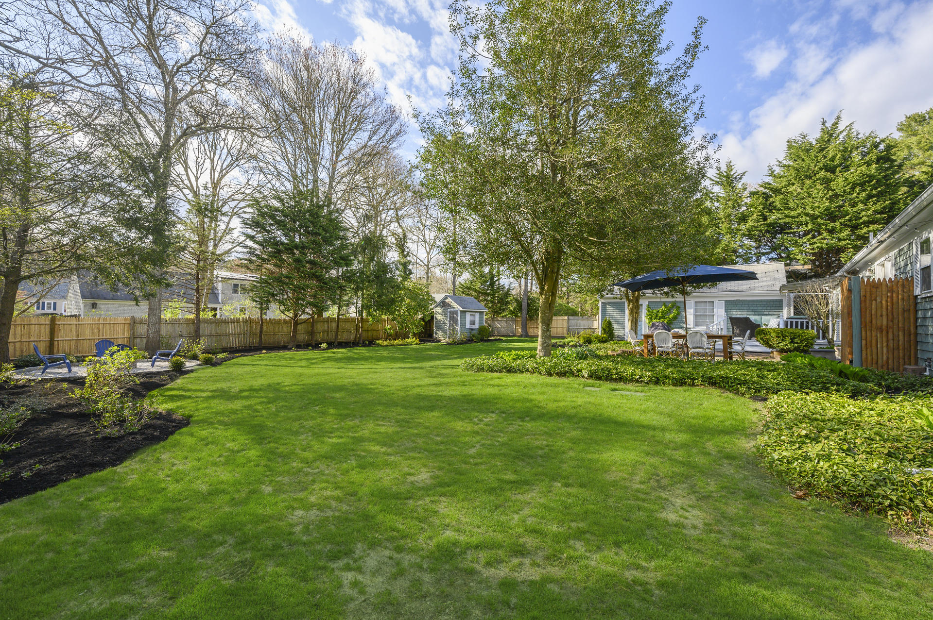 73 Knotty Pine Lane Centerville, MA 02632 - Photo 28 of 34 a front view of a house with garden