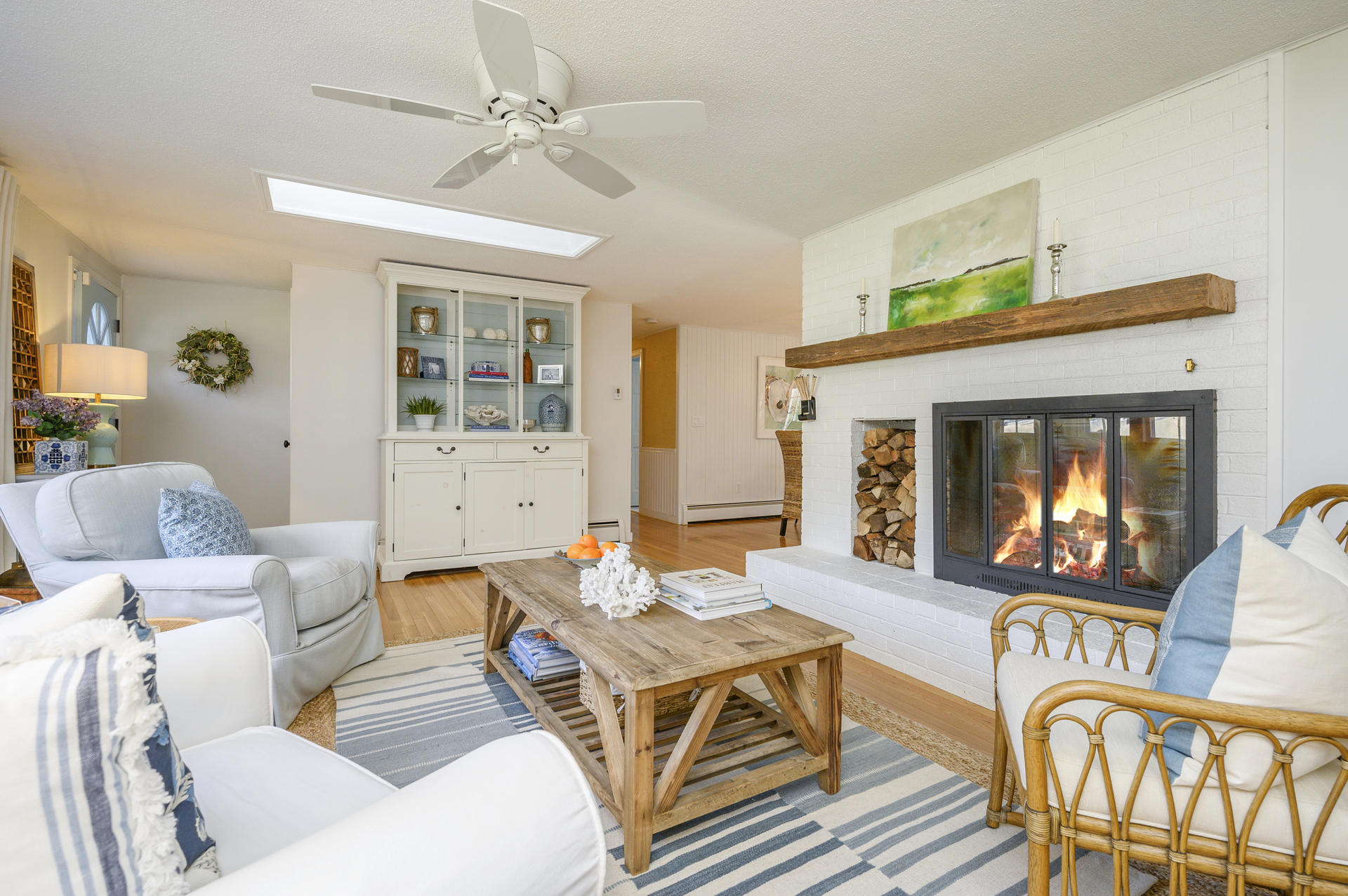 73 Knotty Pine Lane Centerville, MA 02632 - Photo 4 of 34 a living room with furniture a table and a fireplace