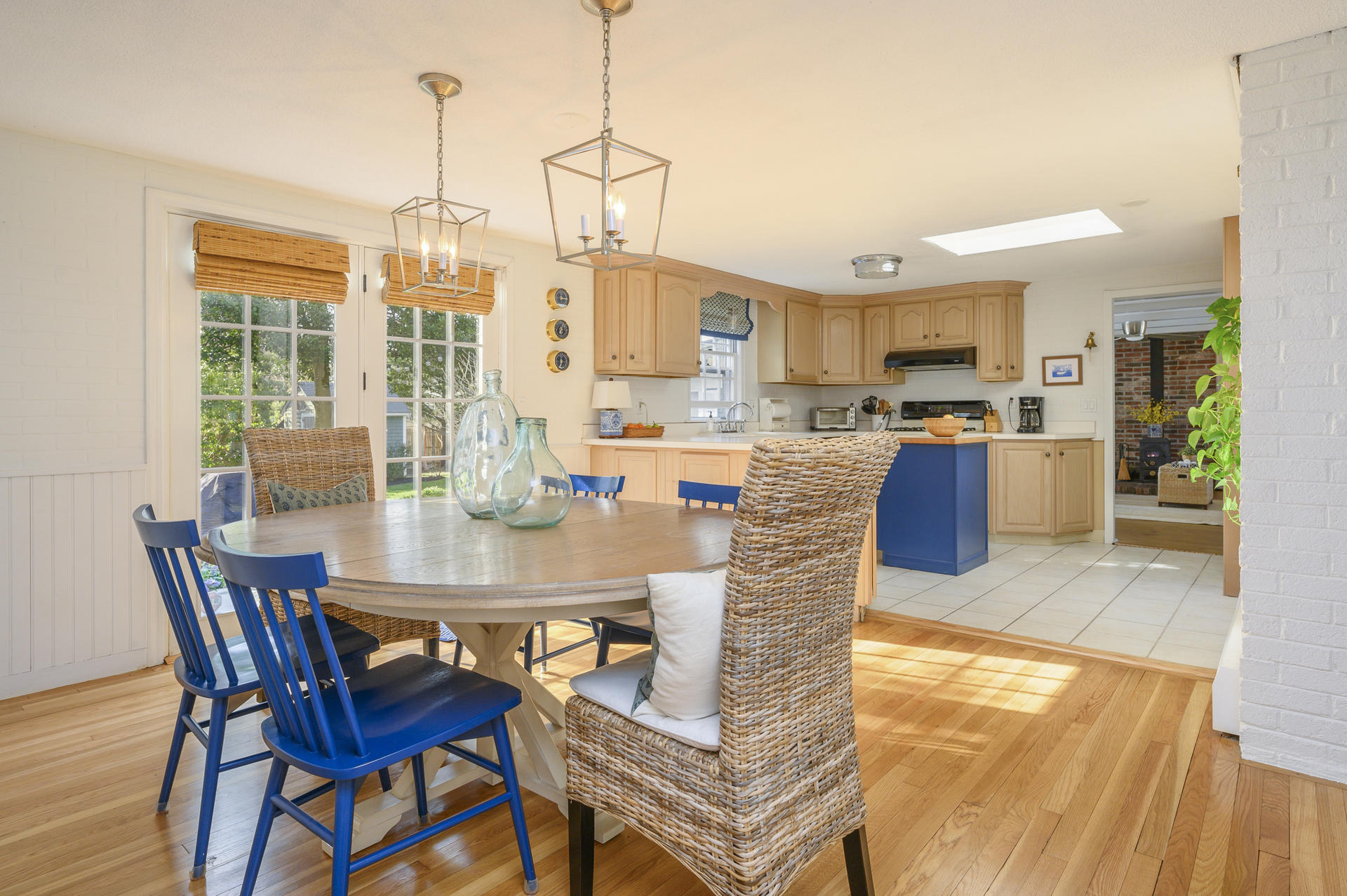 73 Knotty Pine Lane Centerville, MA 02632 - Photo 8 of 34 a view of a dining room and livingroom with furniture wooden floor a chandelier