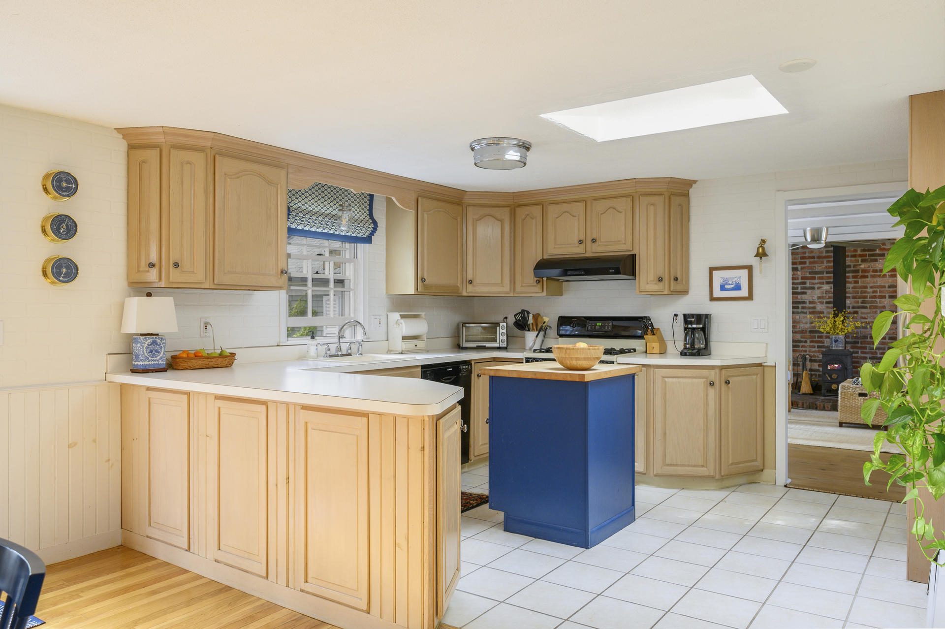 73 Knotty Pine Lane Centerville, MA 02632 - Photo 9 of 34 a kitchen with a refrigerator and a stove top oven