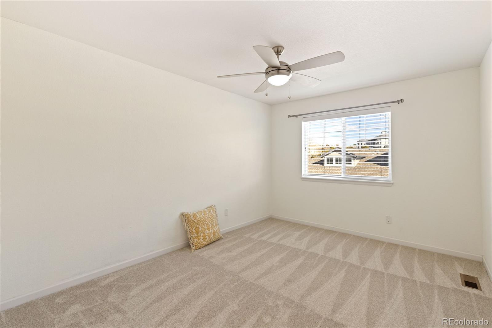 1338 Promontory Bluff View Colorado Springs, CO 80921 - Photo 19 of 28 a view of an empty room with a window