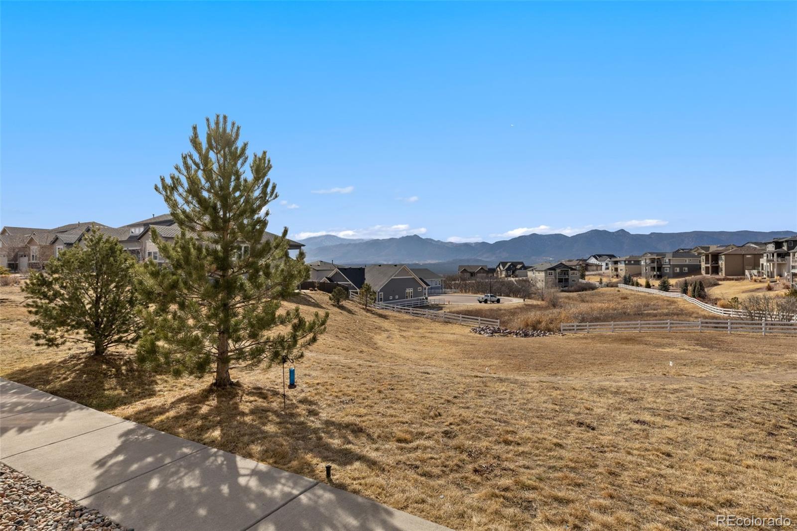 1338 Promontory Bluff View Colorado Springs, CO 80921 - Photo 2 of 28 a view of lake view and mountain view