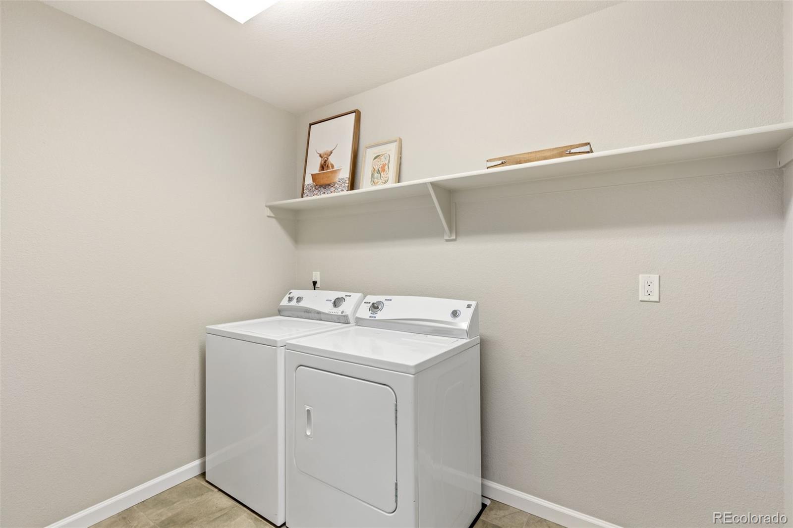 1338 Promontory Bluff View Colorado Springs, CO 80921 - Photo 21 of 28 a utility room with dryer and washer