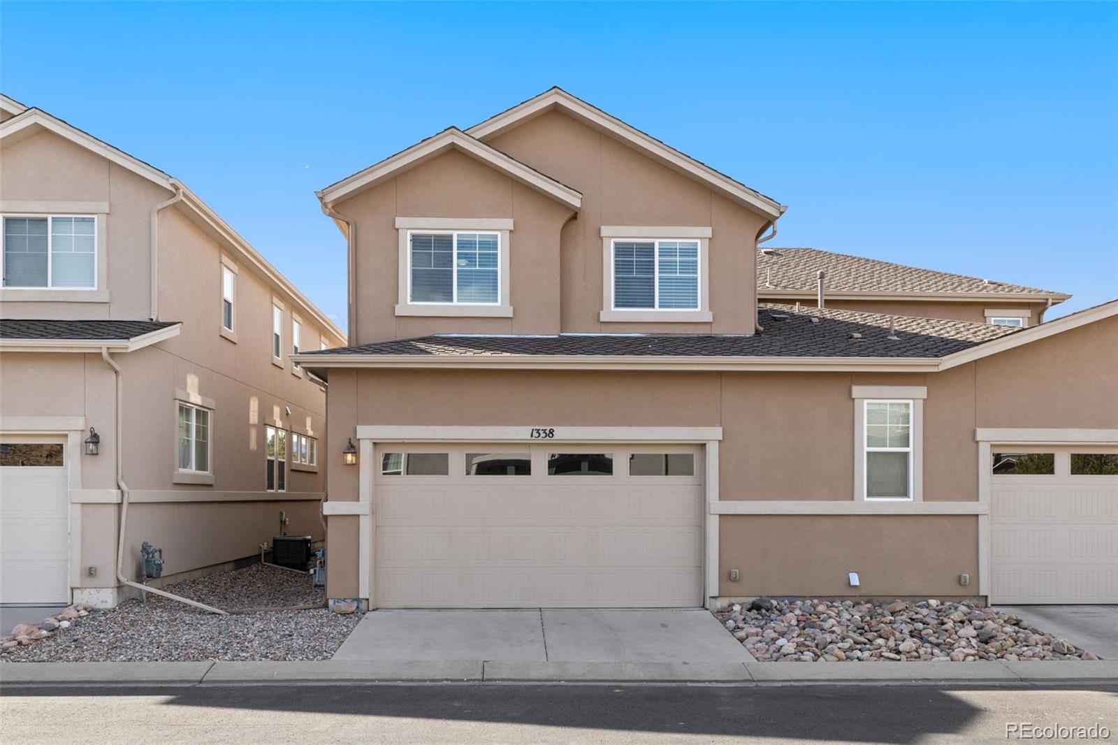1338 Promontory Bluff View Colorado Springs, CO 80921 - Photo 27 of 28 a front view of a house with a garage
