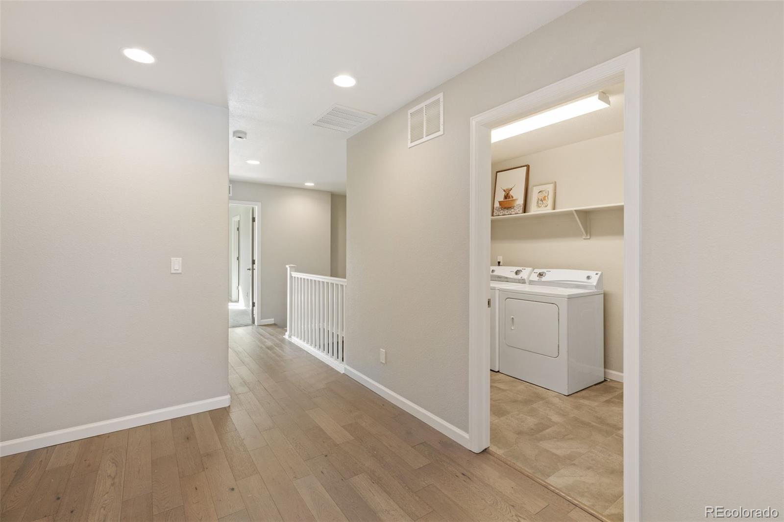1338 Promontory Bluff View Colorado Springs, CO 80921 - Photo 7 of 28 a view of a hallway with bathroom
