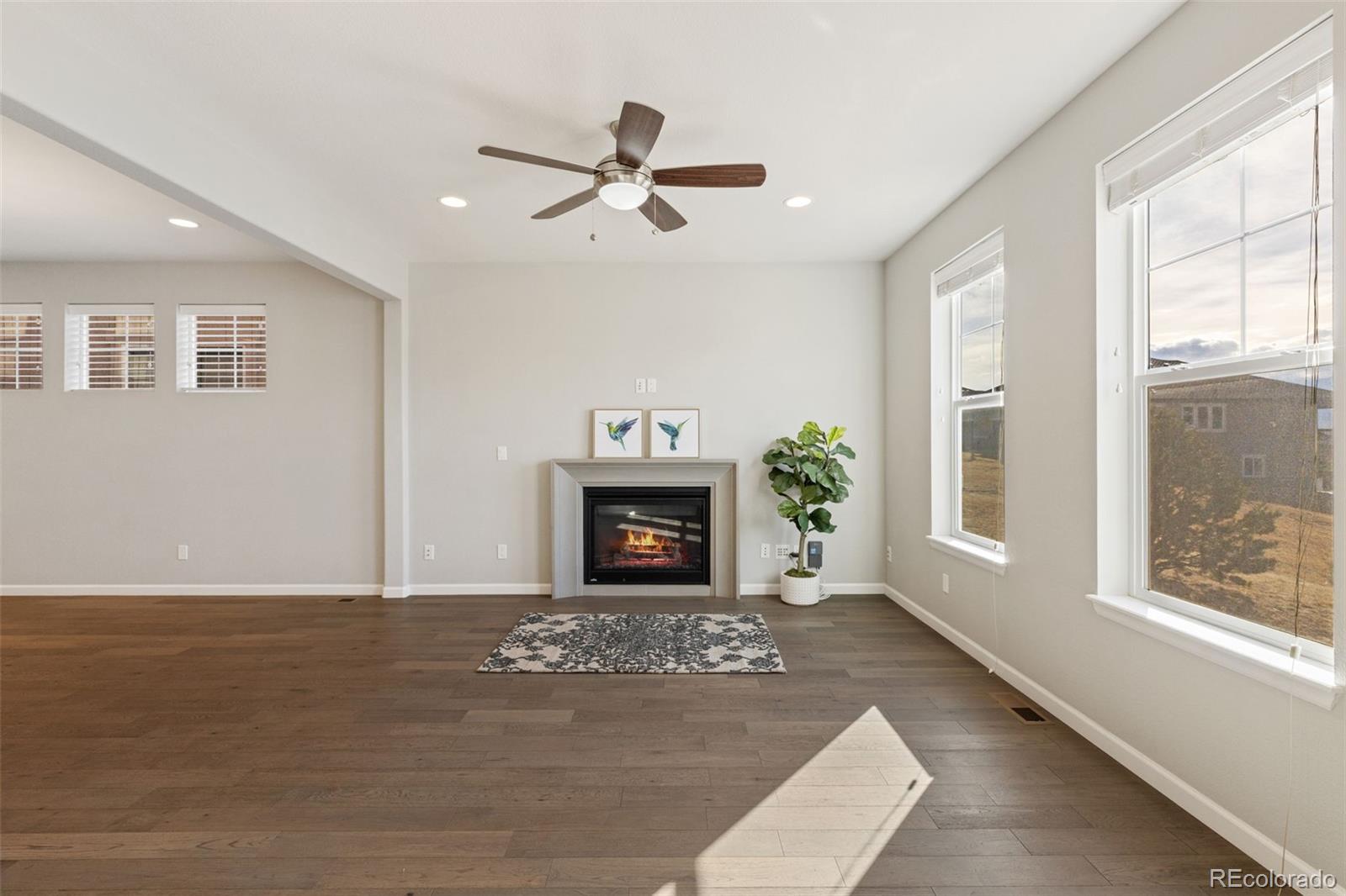 1338 Promontory Bluff View Colorado Springs, CO 80921 - Photo 8 of 28 a view of a livingroom with a fireplace window and fire place