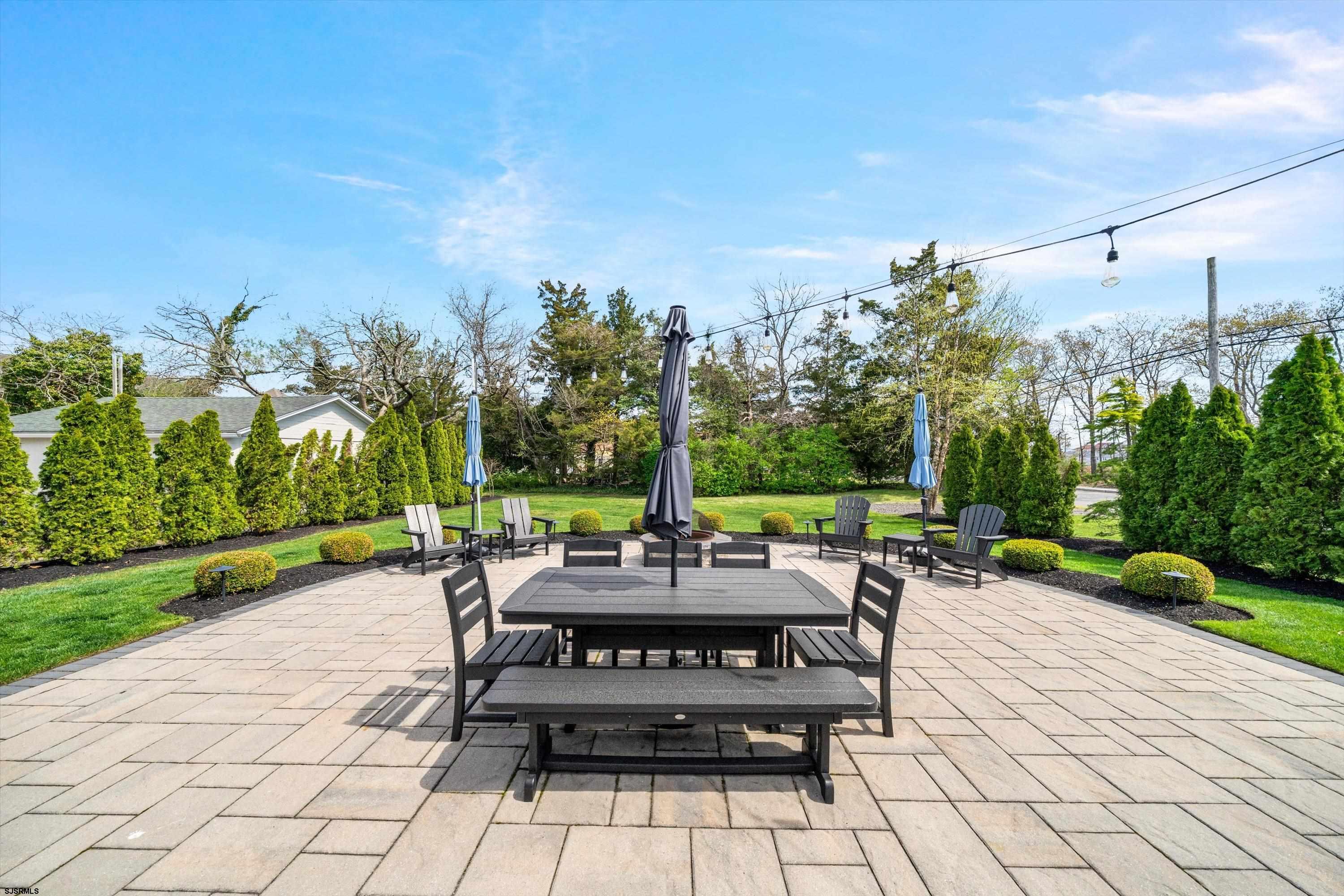 33 Harbor Lane Somers Point, NJ 08244 - Photo 13 of 70 a view of a patio with a table and chairs under an umbrella