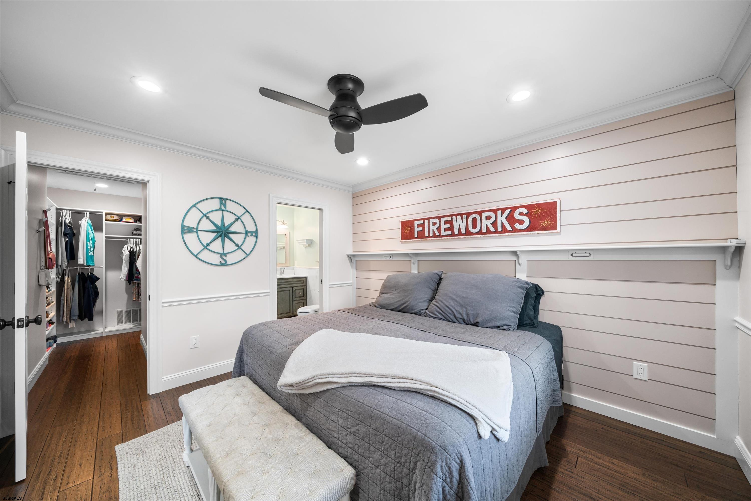 33 Harbor Lane Somers Point, NJ 08244 - Photo 31 of 70 a bedroom with a bed and a chandelier