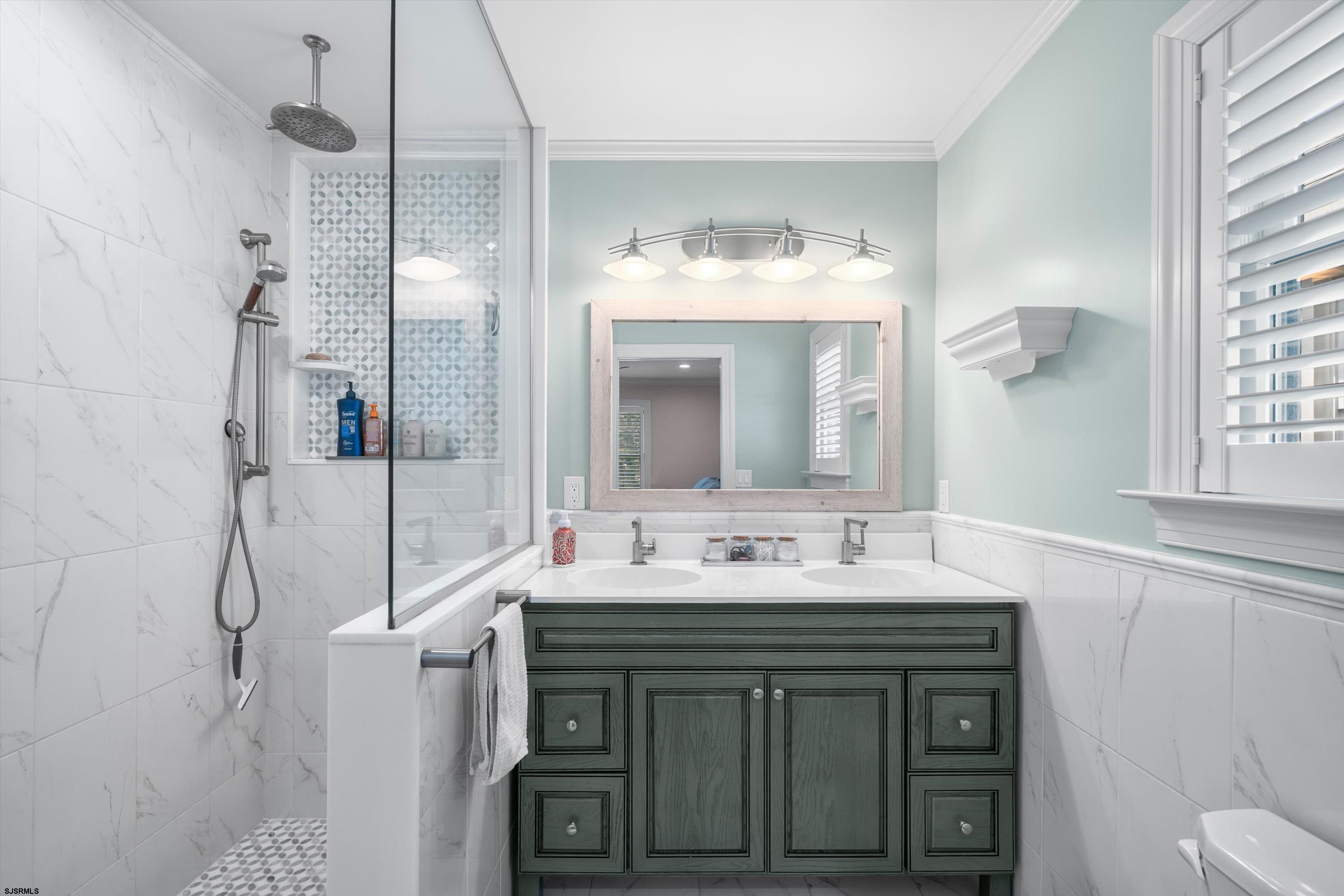 33 Harbor Lane Somers Point, NJ 08244 - Photo 35 of 70 a bathroom with a sink vanity and a mirror