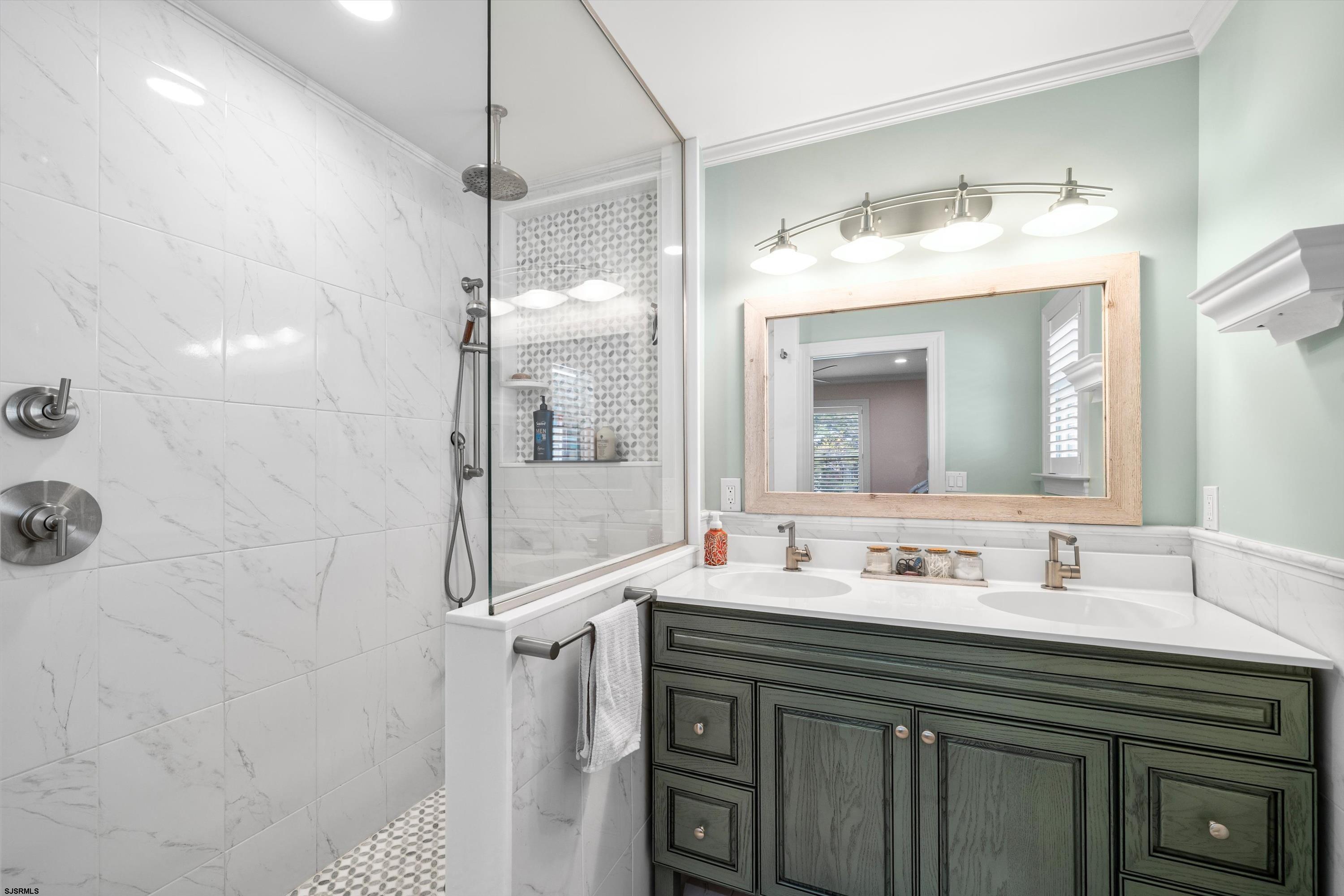 33 Harbor Lane Somers Point, NJ 08244 - Photo 36 of 70 a bathroom with a sink vanity and a mirror