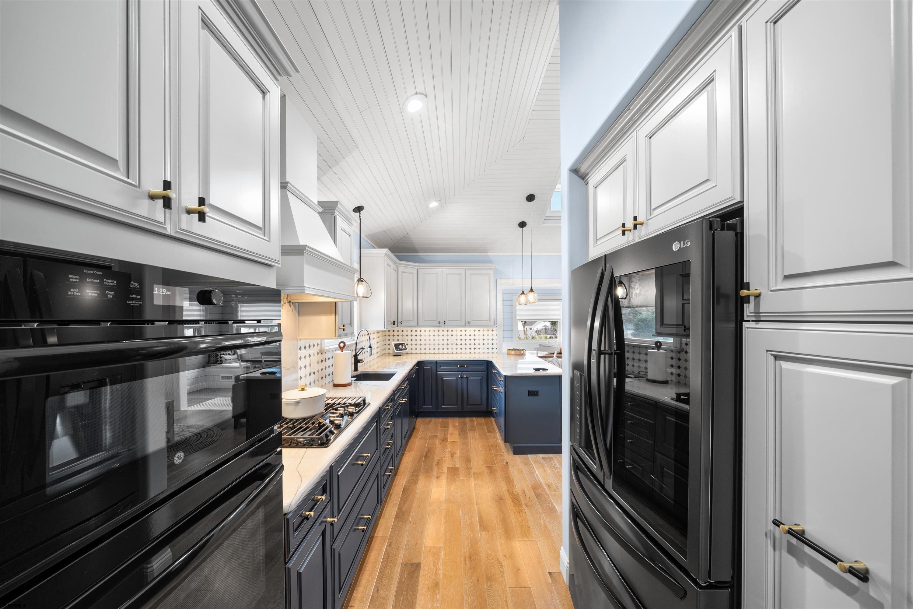 33 Harbor Lane Somers Point, NJ 08244 - Photo 43 of 70 a kitchen with stainless steel appliances a refrigerator a stove and a sink