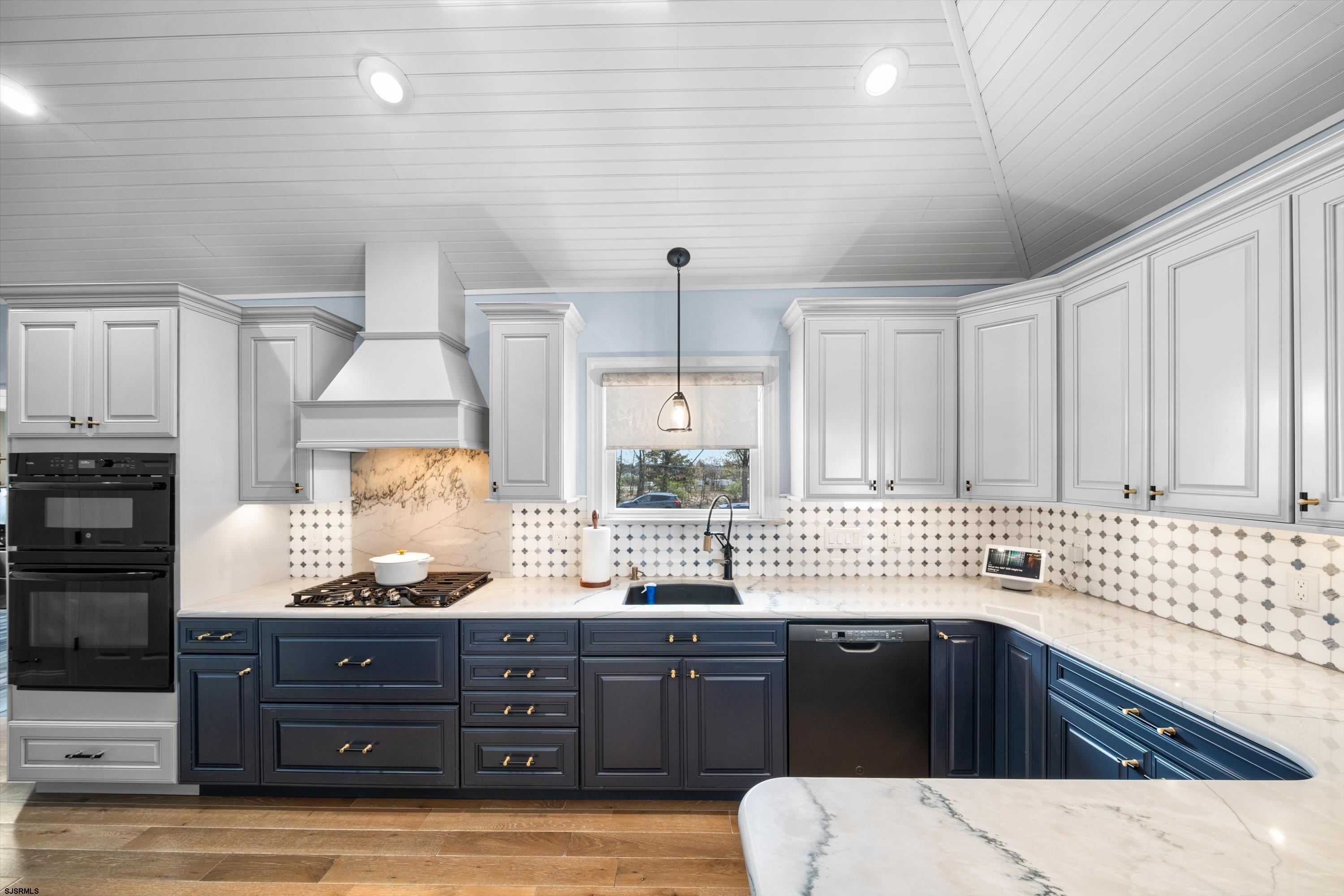33 Harbor Lane Somers Point, NJ 08244 - Photo 46 of 70 a kitchen with granite countertop a sink and cabinets