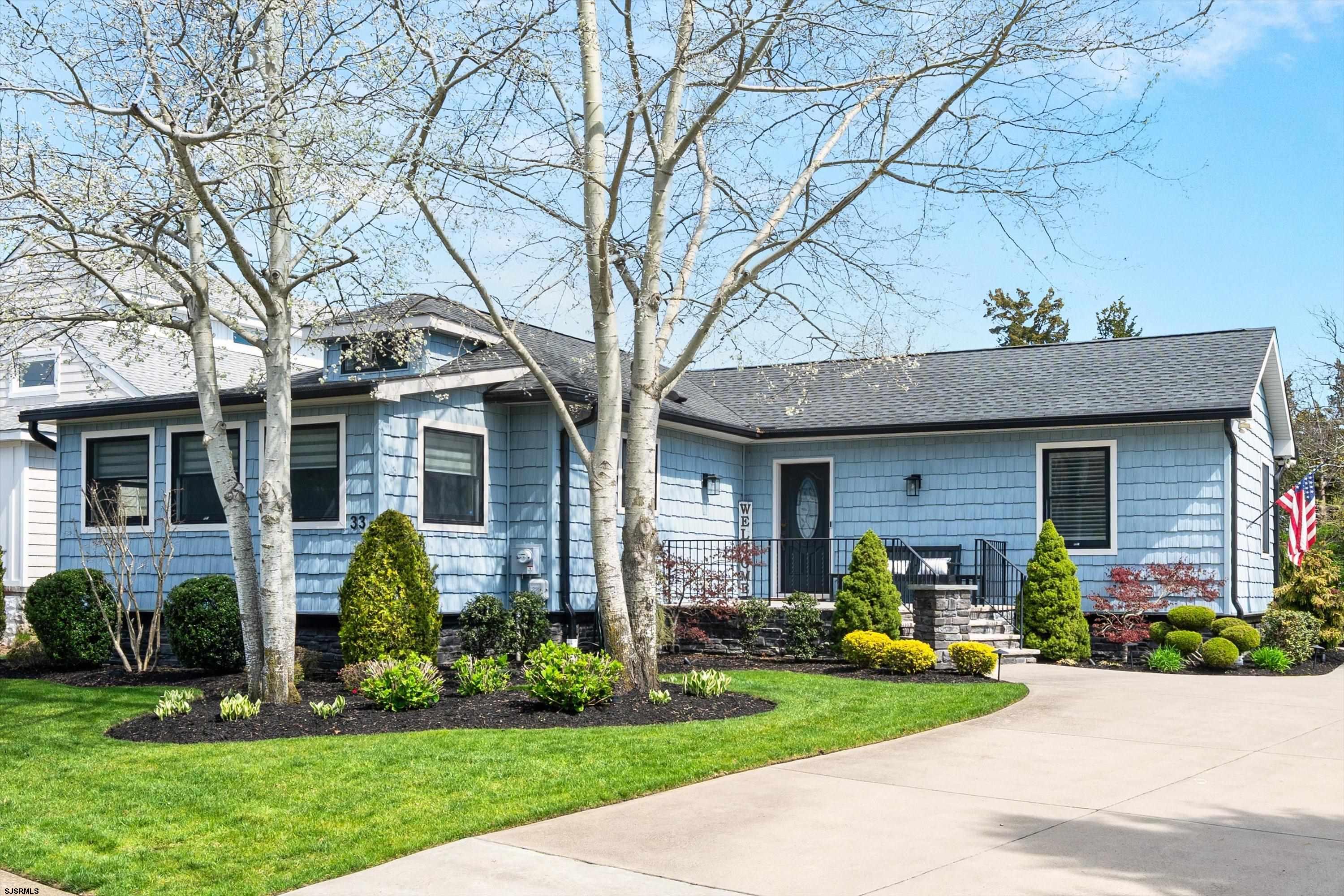 33 Harbor Lane Somers Point, NJ 08244 - Photo 6 of 70 a front view of a house with a garden and plants