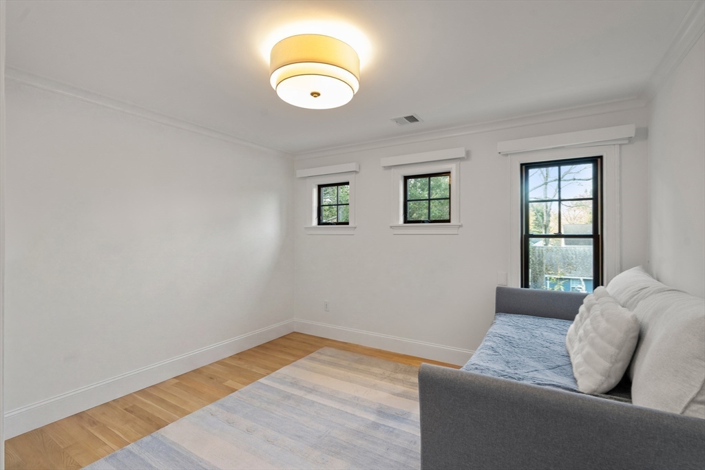 7 Massasoit Road Wellesley, MA 02481 - Photo 30 of 42 a living room with couch and a window